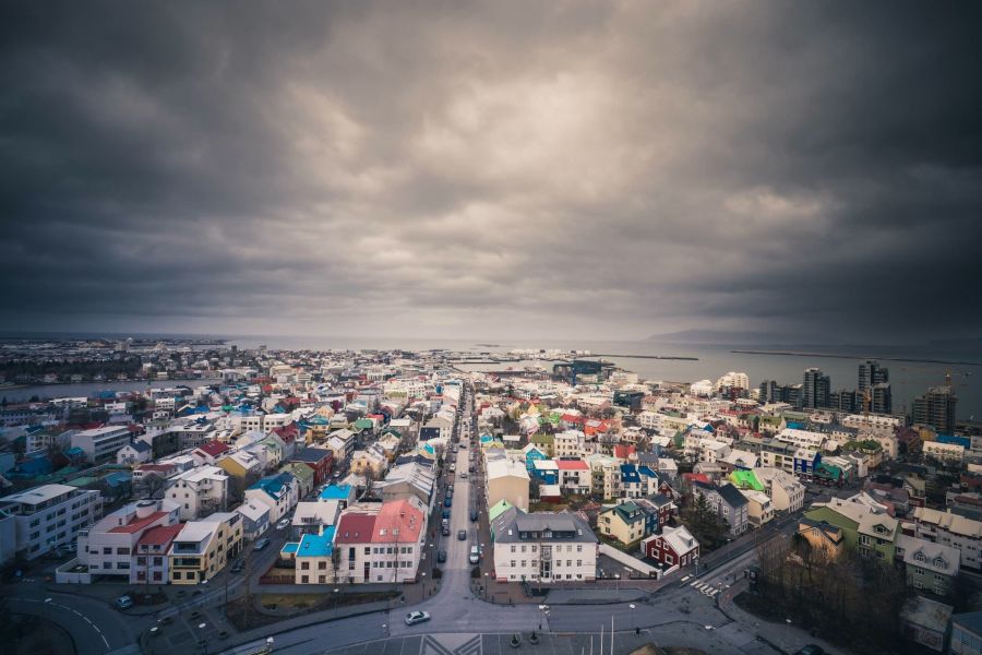 Wide view of Reykjavik with stormy clouds.