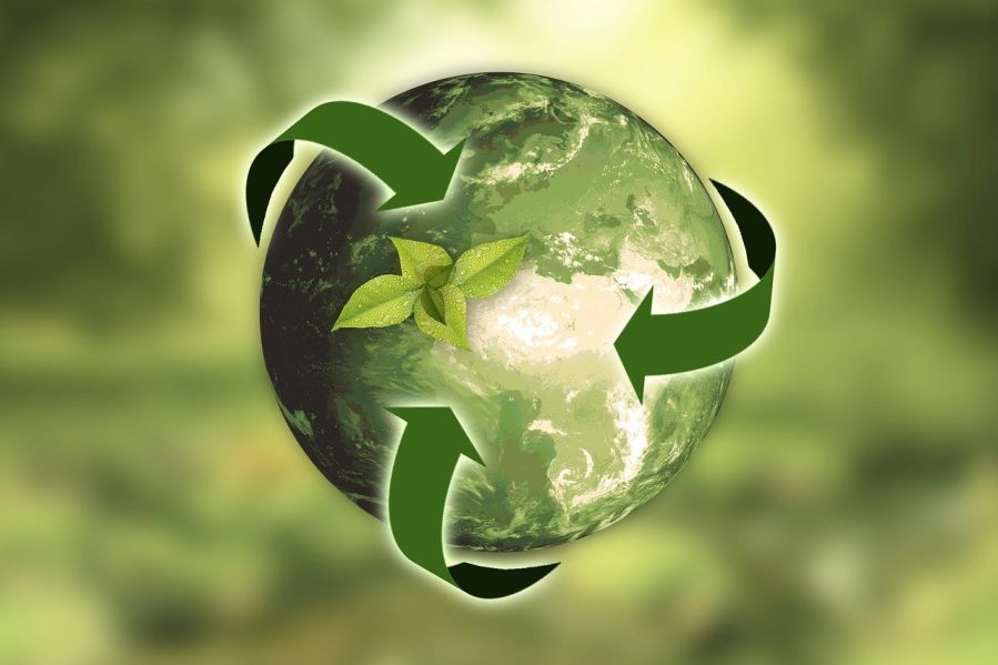 Recycling symbol over the planet.