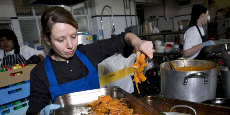 Chef Nicole Pisani serving quality school meals .