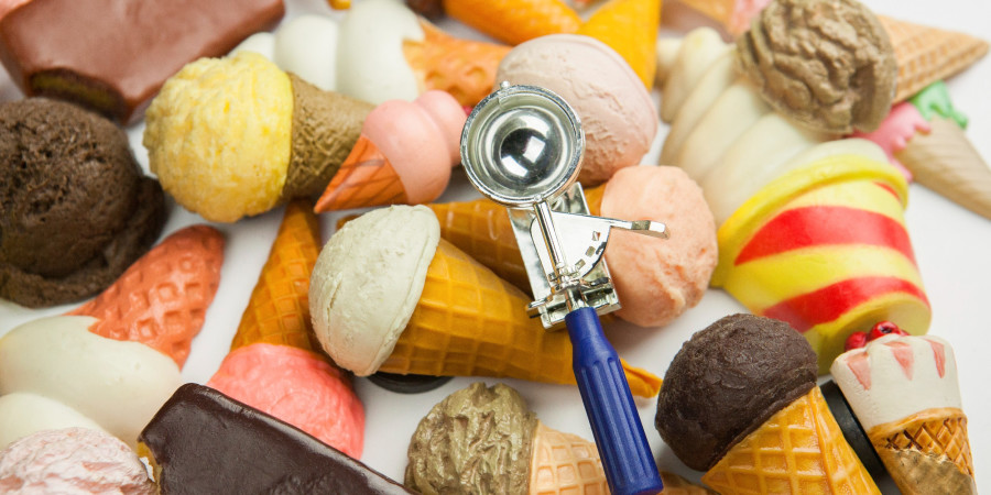 selection of ice cream cones and a scoop.
