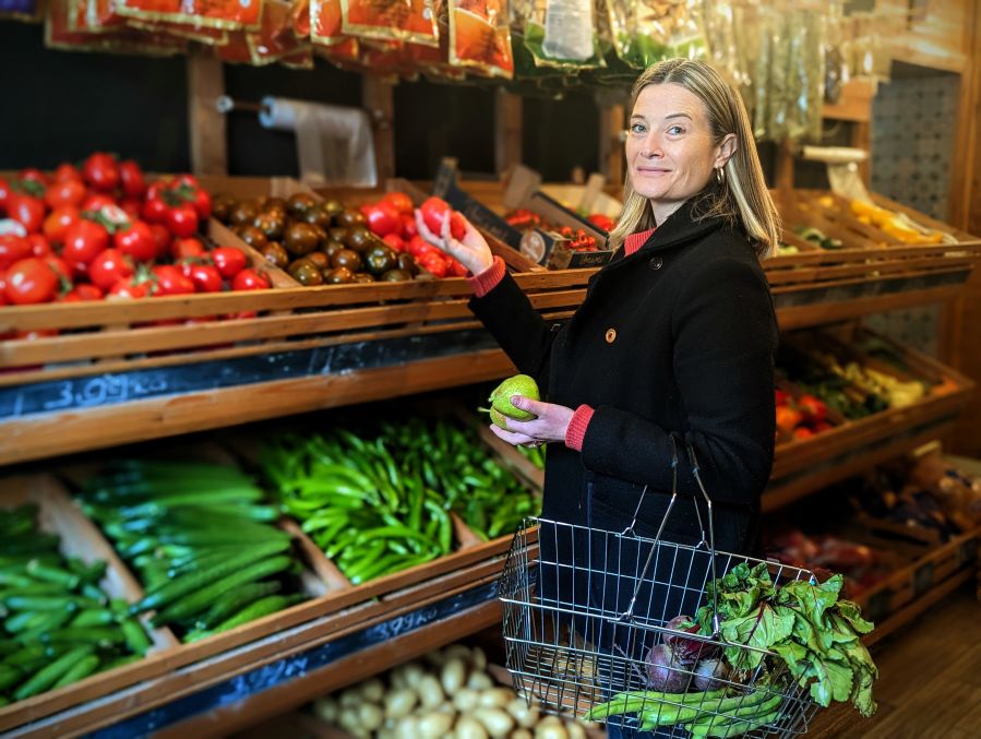 woman in grocery section of a shop.