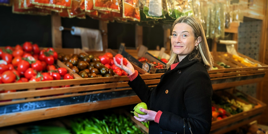 woman in grocery section of a shop.